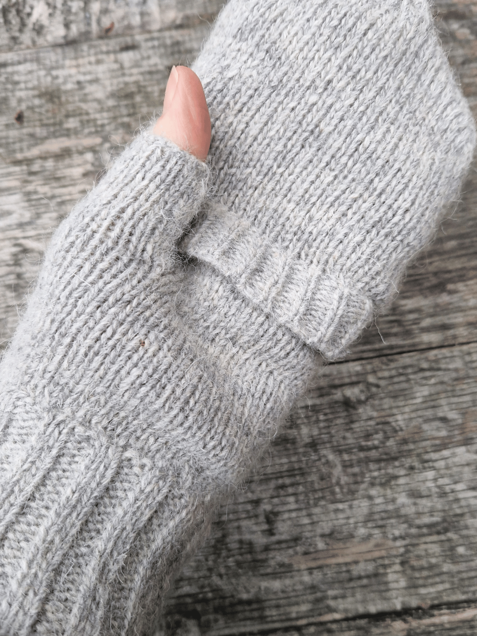 mitten top folded over on knitted fingerless gloves