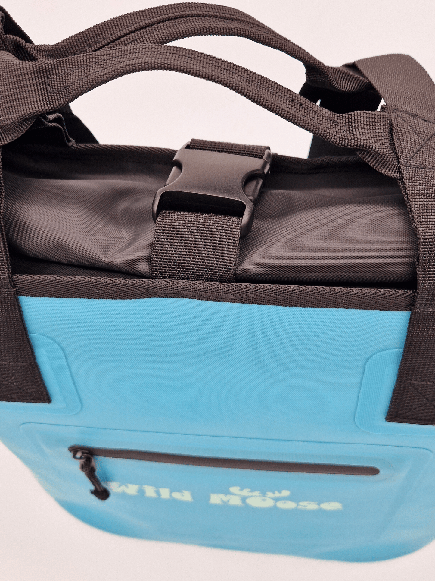 close up product shot a bright blue tote bag with Wild Moose logo