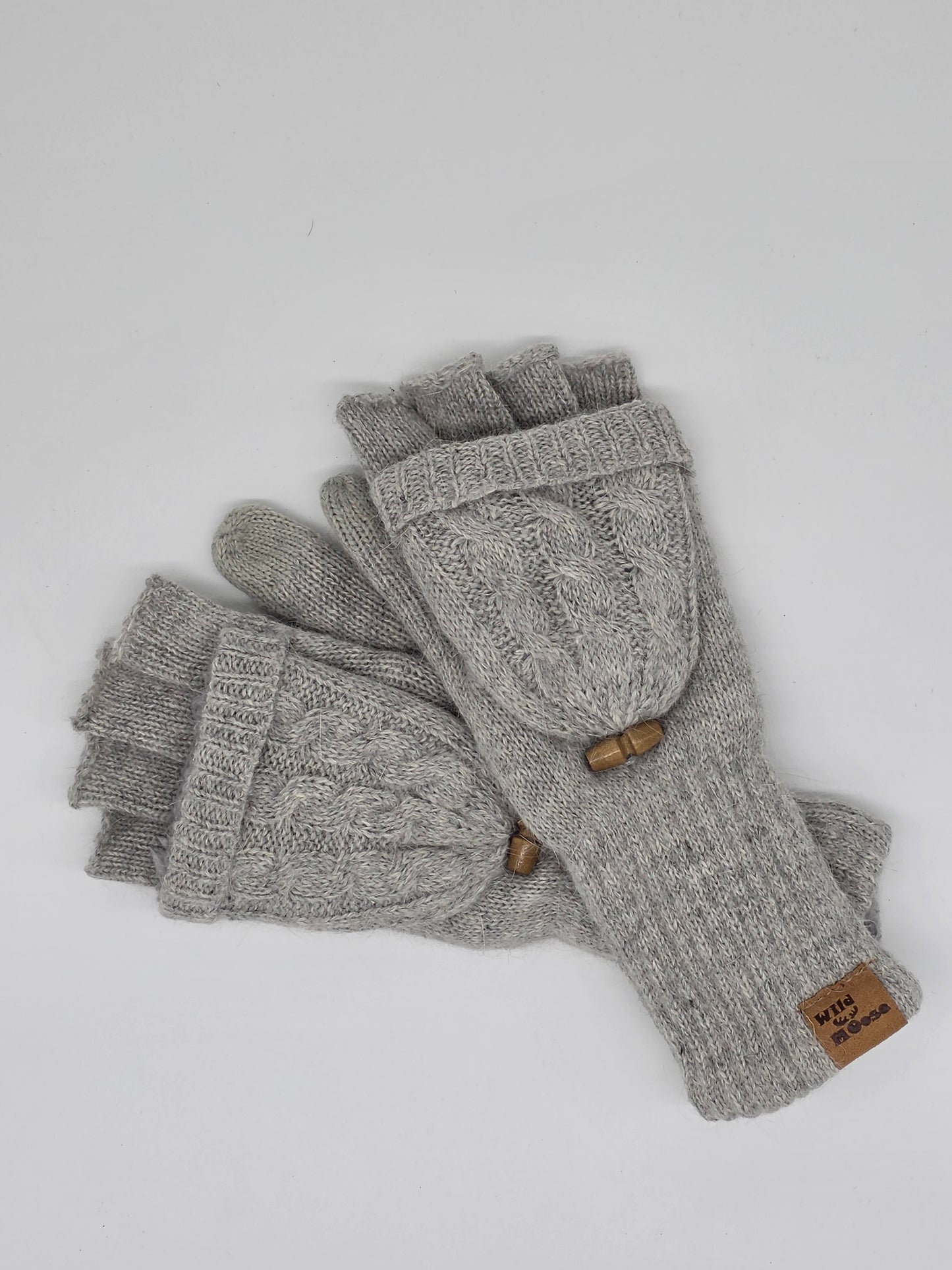 grey knit fingerless mittens on a white background.