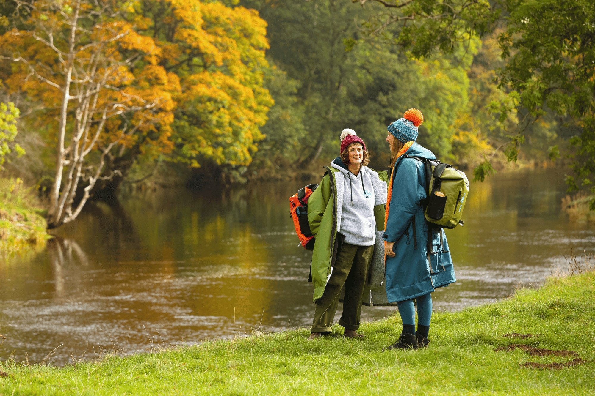 Wild Moose customers wearing changing robes outdoors by a river