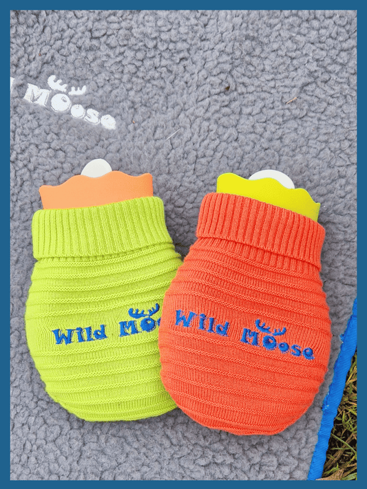 brightly coloured mini hot water bottles in a knitted cover in orange and lime green