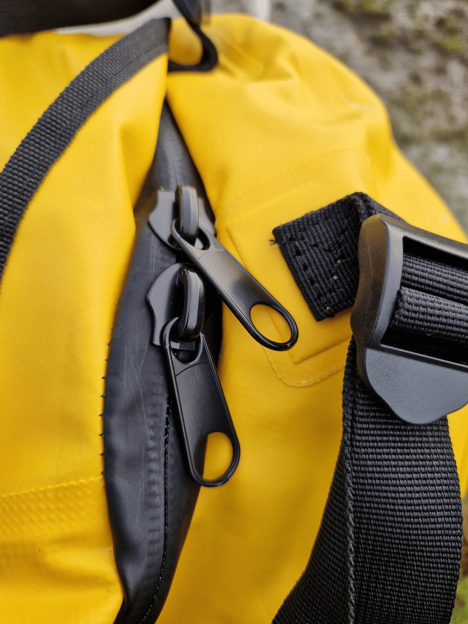 close of the splashproof, rubberised zip fastening