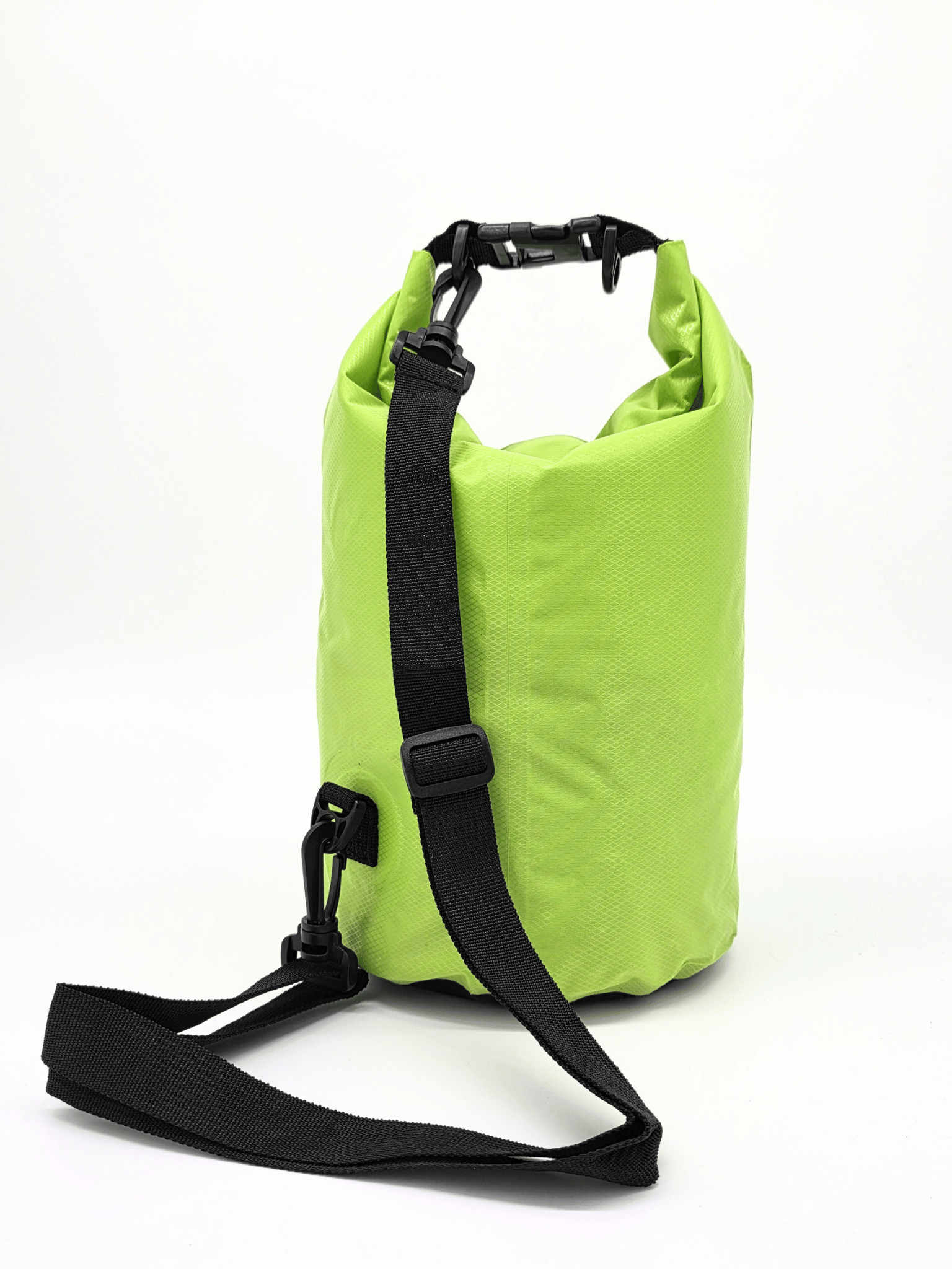 neon green drybag with black strap on a white background