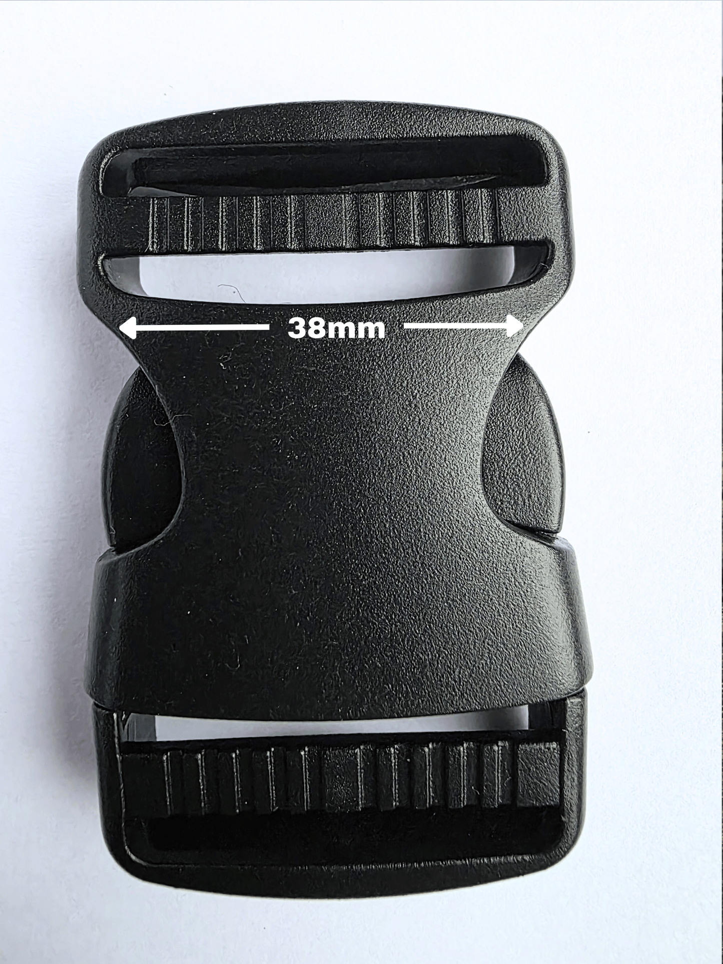 Black, plastic side release buckle with strap width shown at 38mm