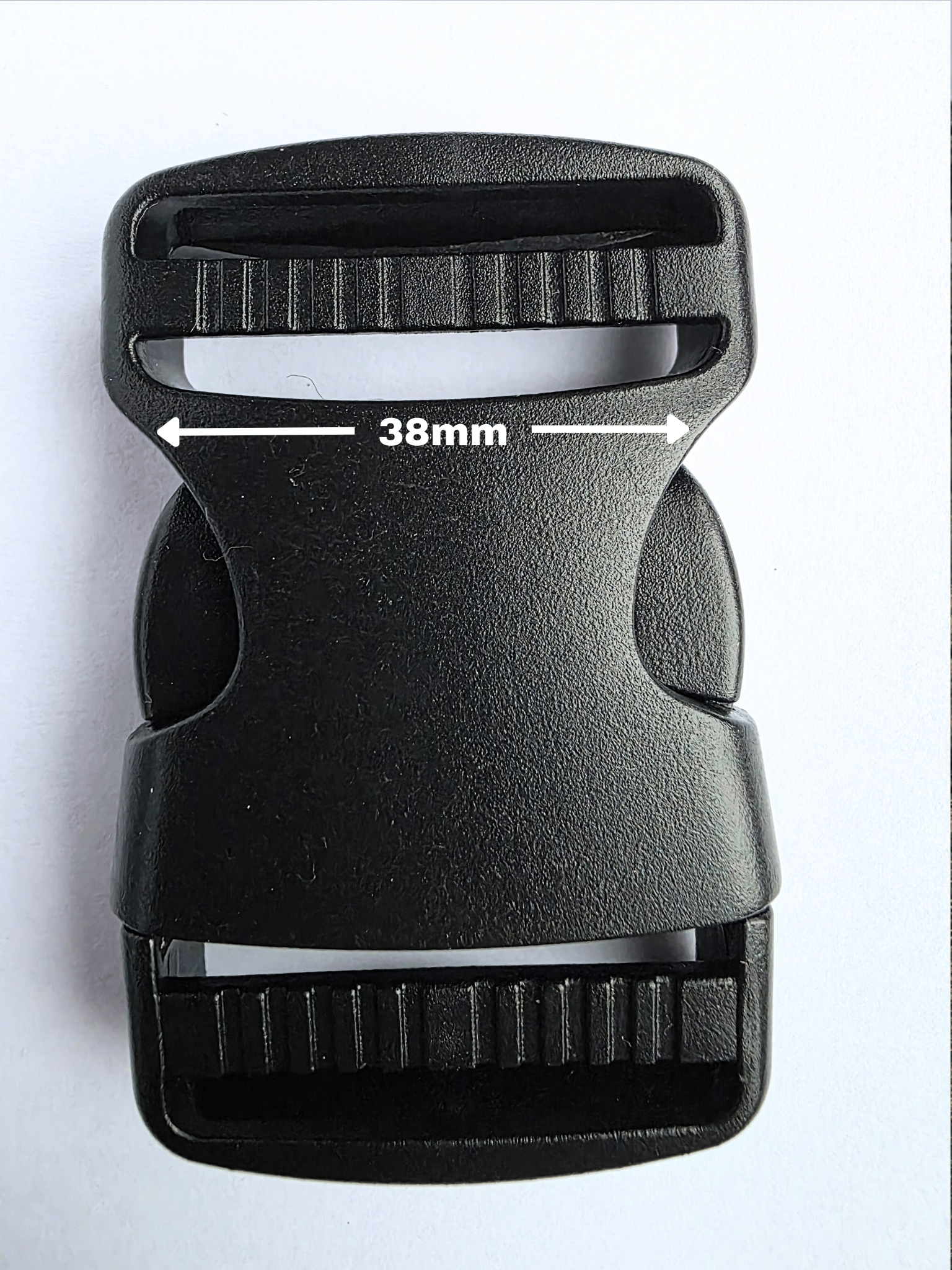 Black, plastic side release buckle with strap width shown at 38mm