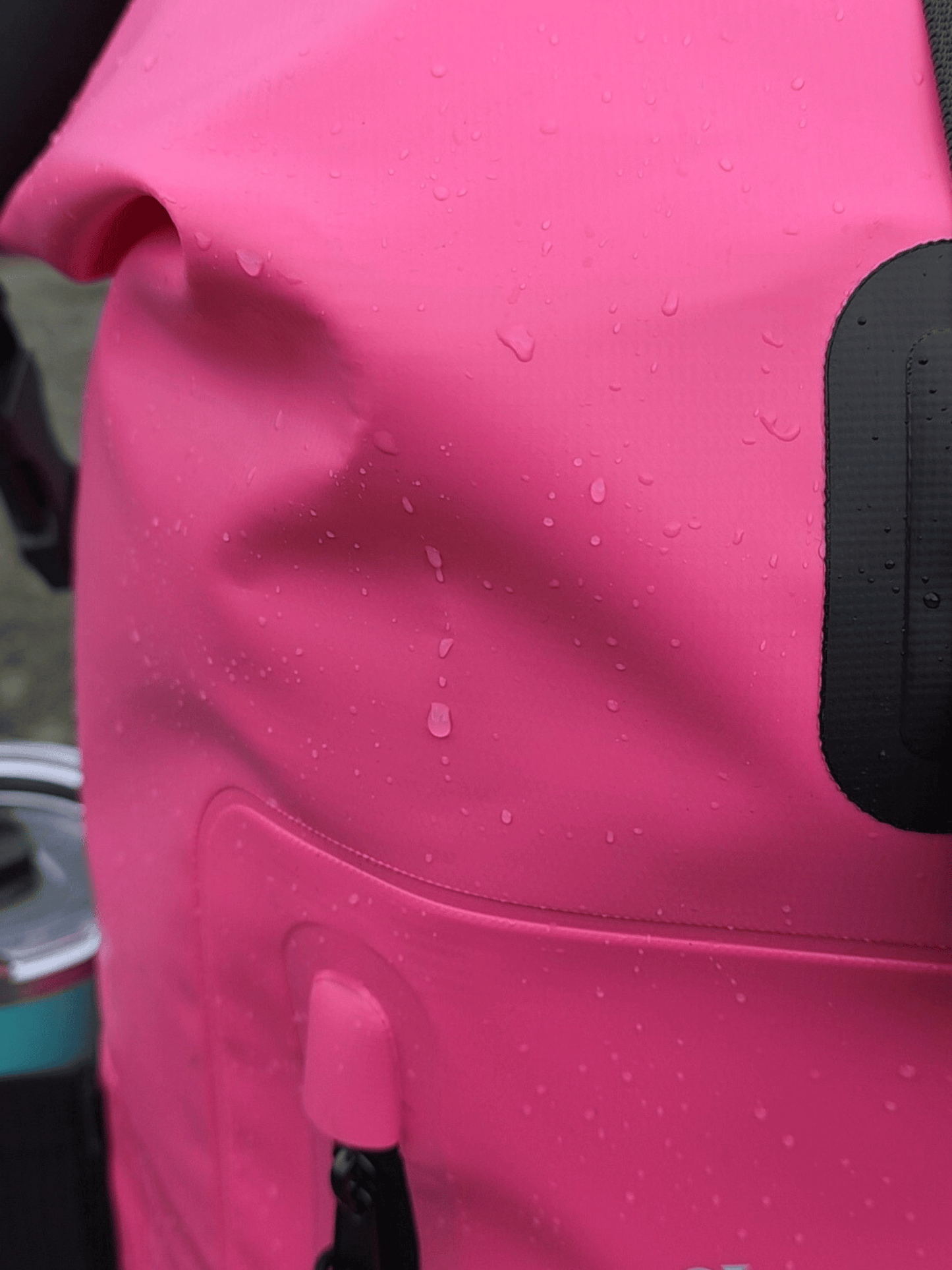 Close-up of a pink bag with water droplets on it