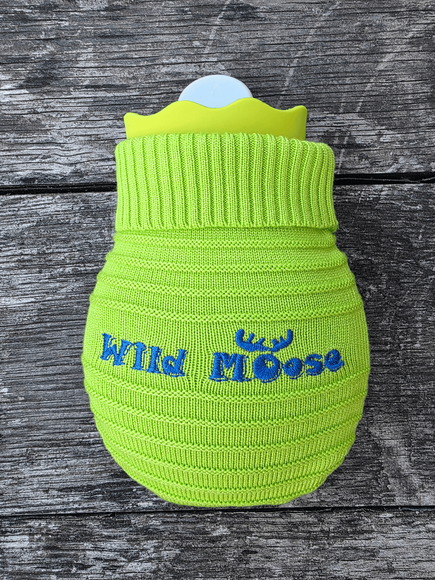 mini hot water bottles in a knitted cover in a bright green