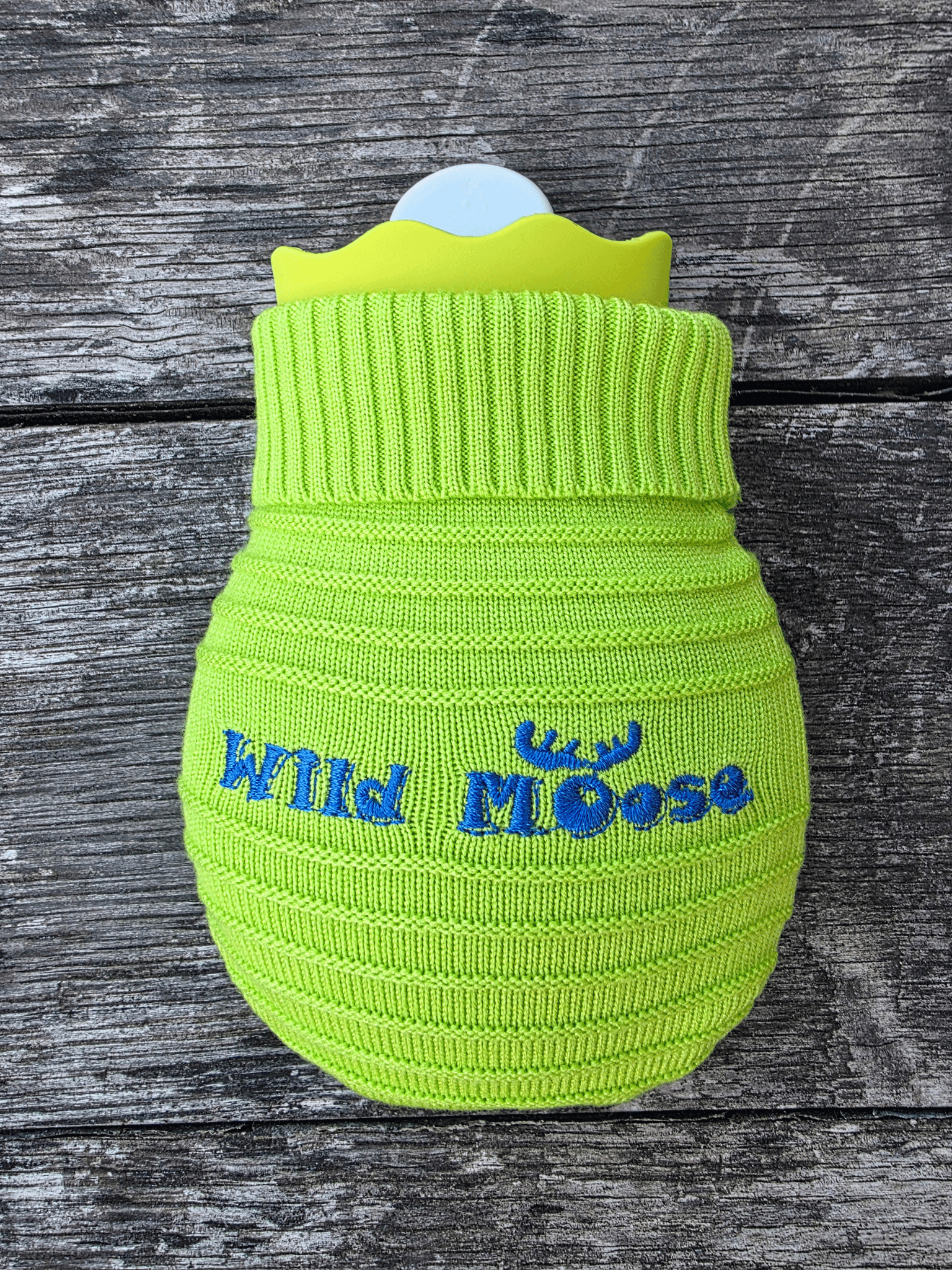mini hot water bottles in a knitted cover in a bright green