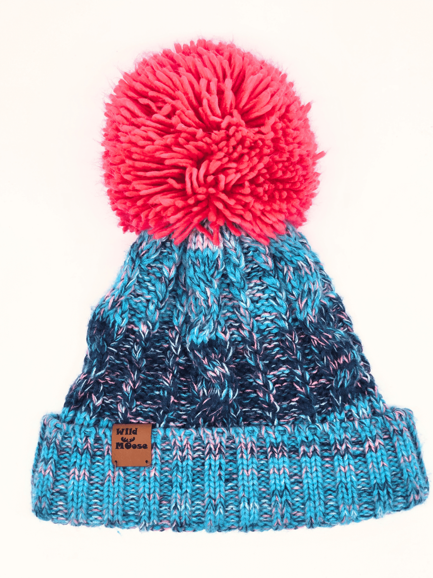 blue knitted beanie with a pink pom-pom on a white background.