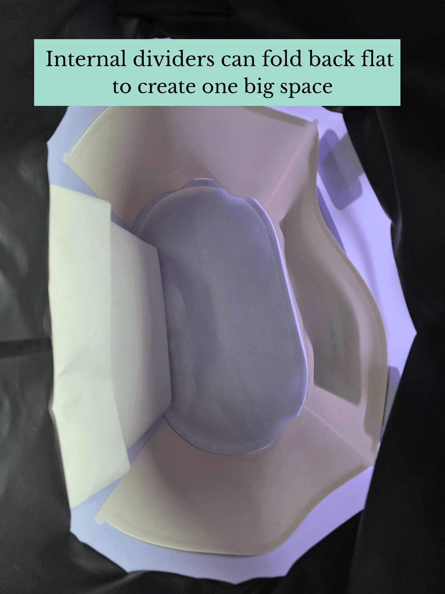 Inside a tote bag showing internal dividers pushed back flat against the bag walls