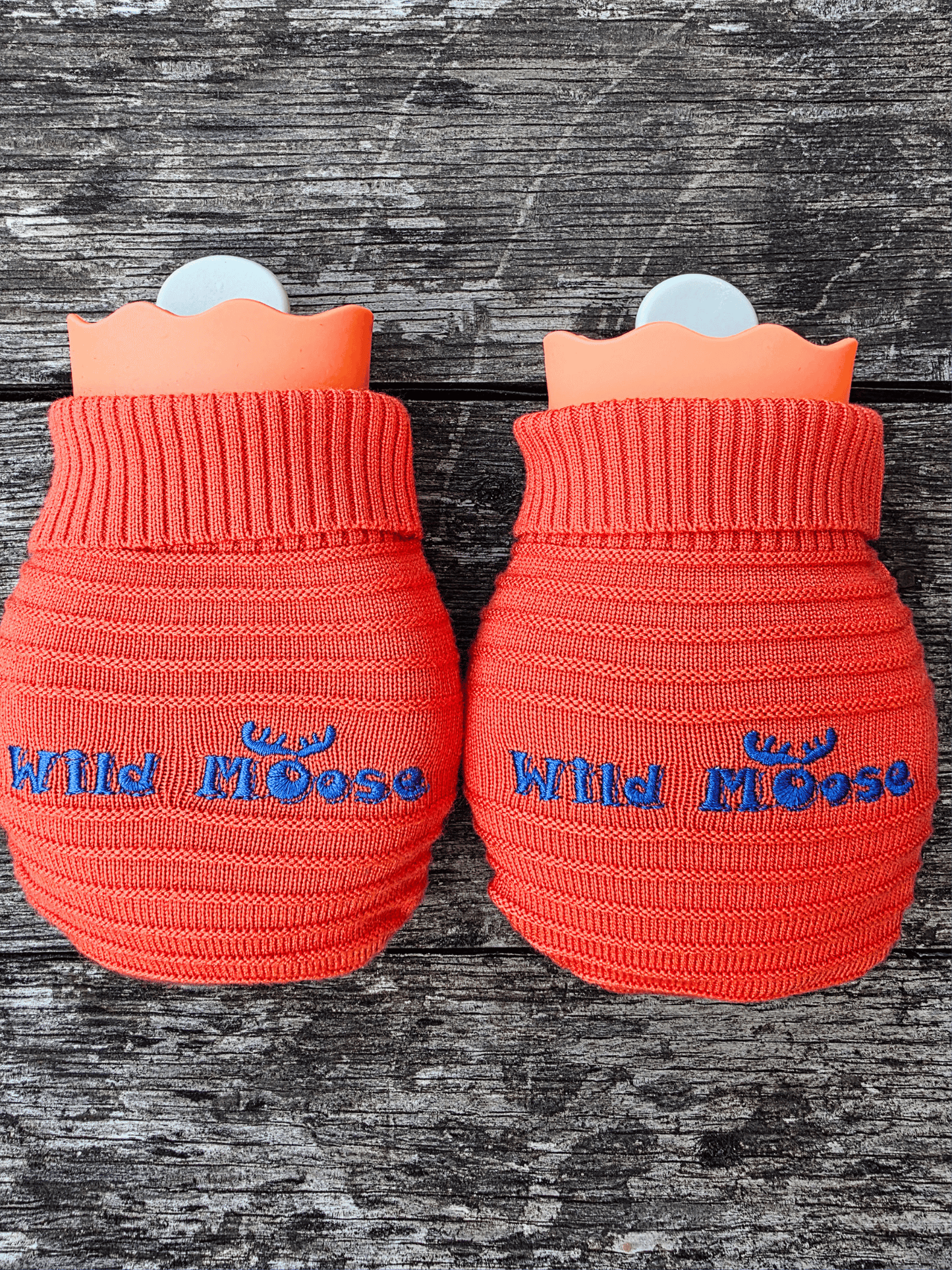 2 mini hot water bottles in a knitted cover - both bright orange