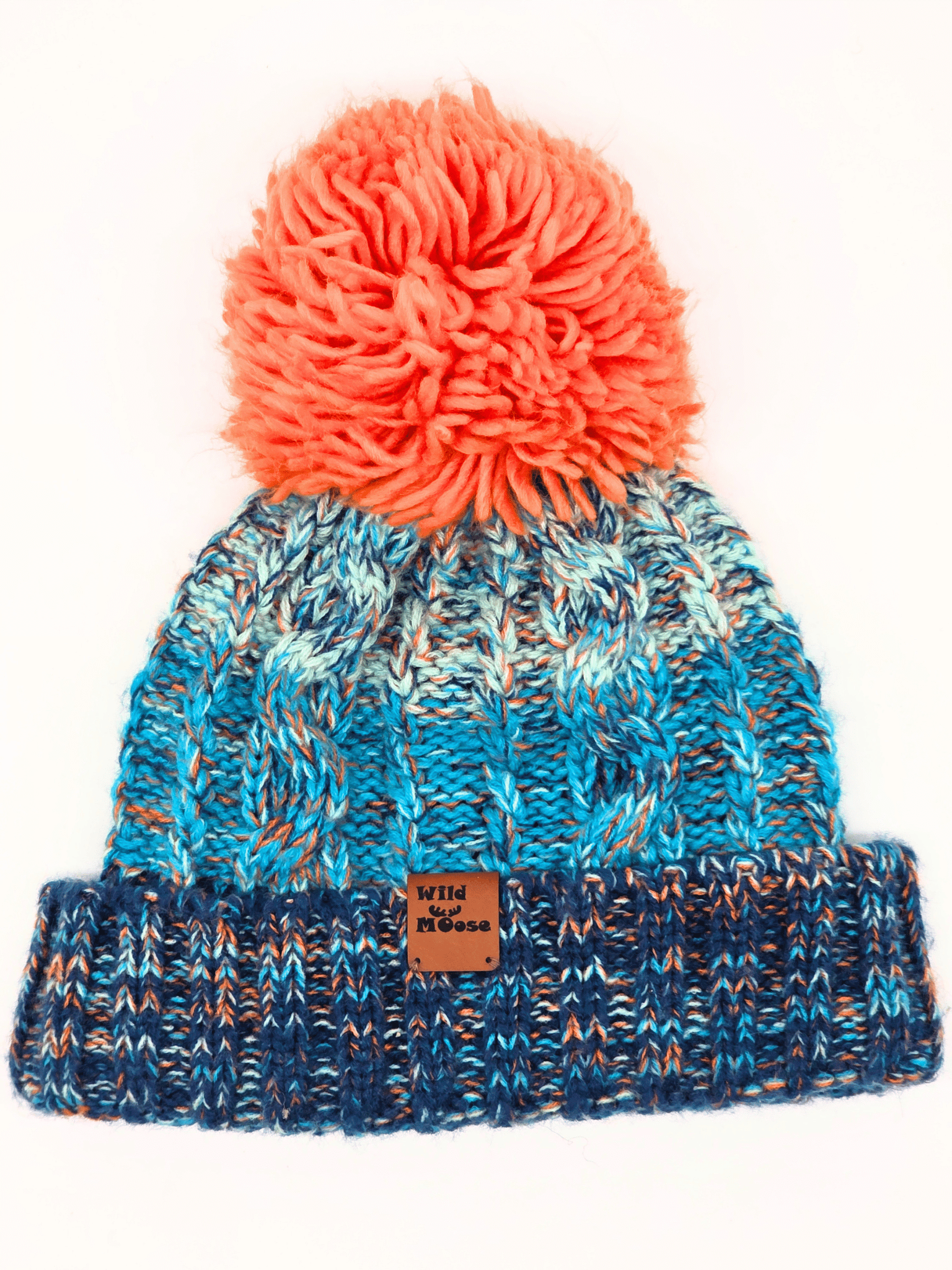 blue knitted beanie with an orange pom-pom on a white background.